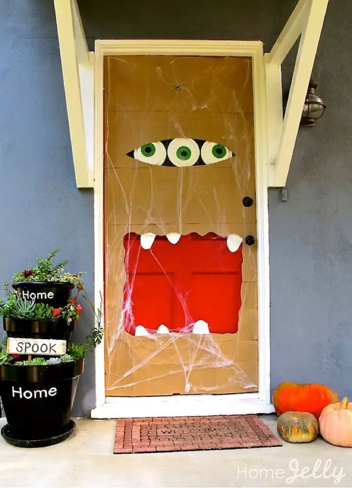 42 Quick Halloween Door Decorations You Can Create in Under an Hour 31 Three Eyeballed Monster Door