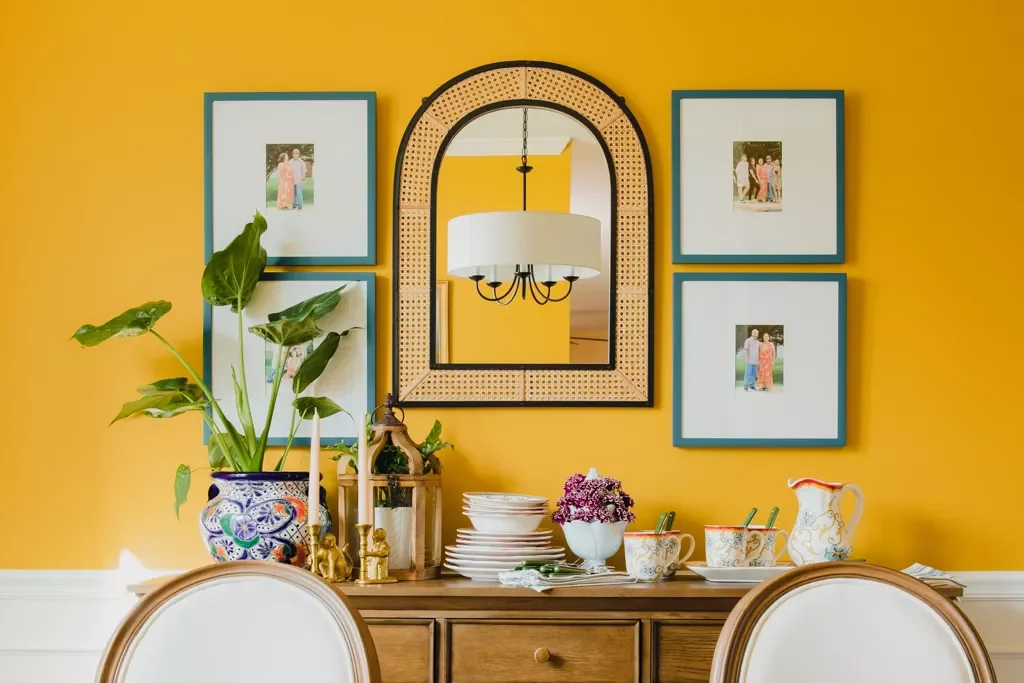 26 Creative Family Photo Wall Ideas That Will Transform Your Home 15 Throw a Statement Mirror in the Mix
