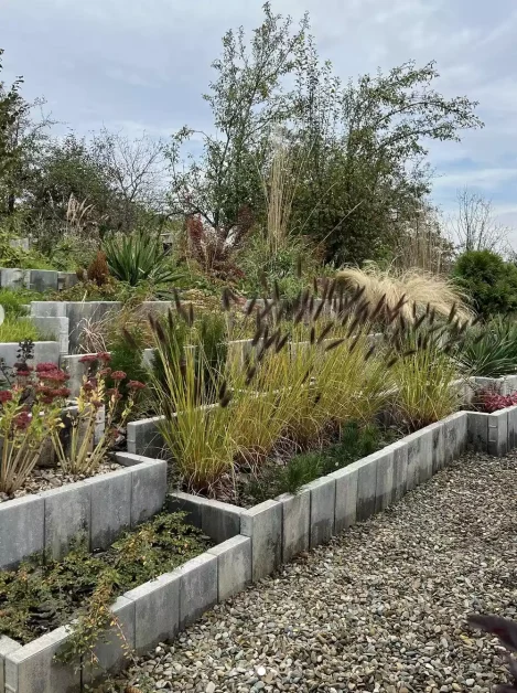 25 Stunning Garden Border Ideas That'll Transform Your Yard Into a Polished Paradise 10 Tiered Vertical Stone Barriers