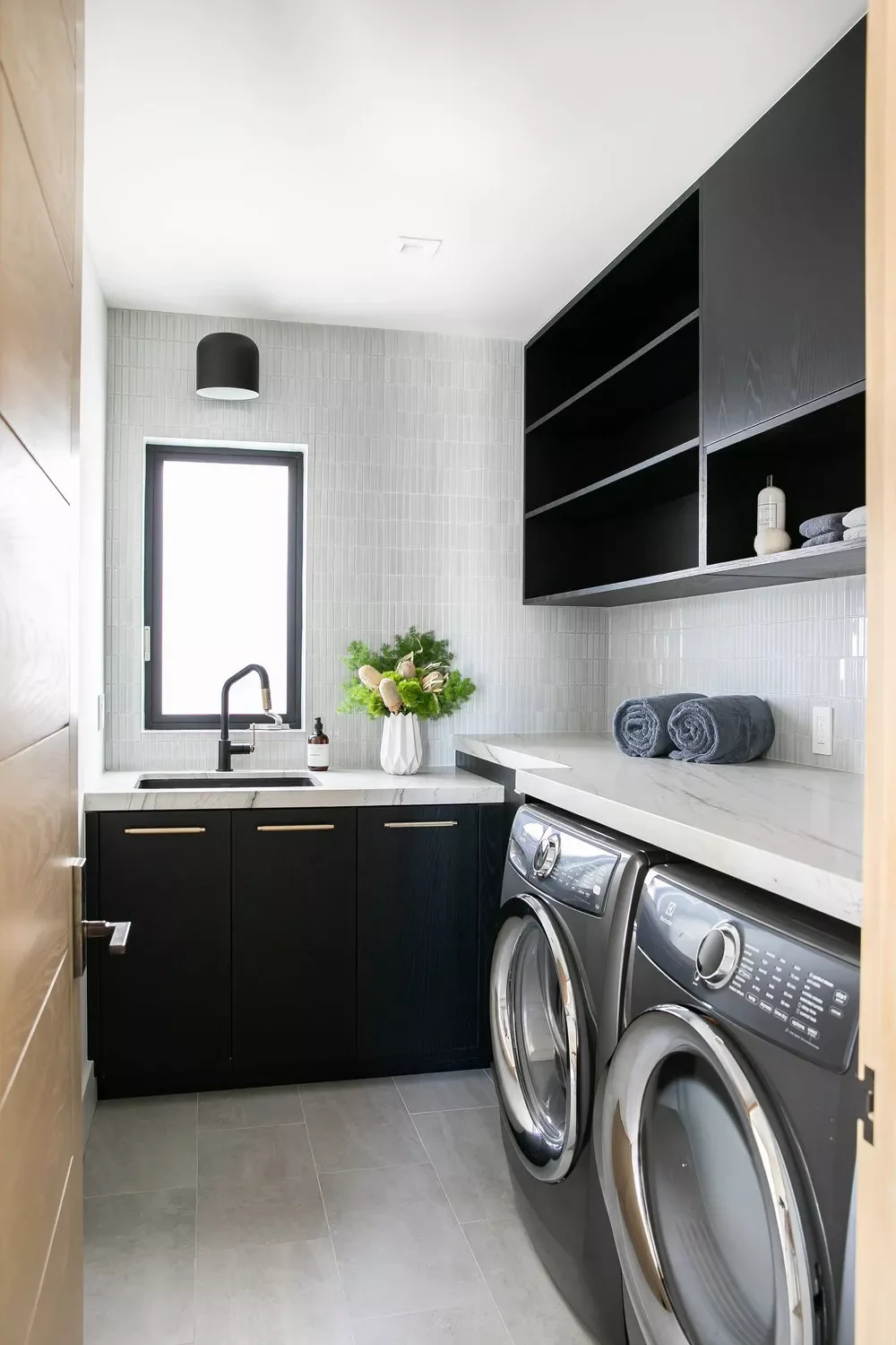 55 Small Laundry Room Ideas That Blend Style With Smart Functionality Tile a Full-Wall Backsplash