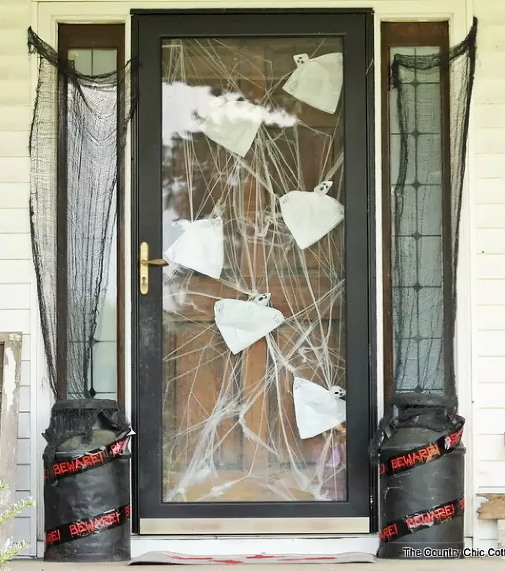 42 Quick Halloween Door Decorations You Can Create in Under an Hour 26 Trapped Ghosts Door Display