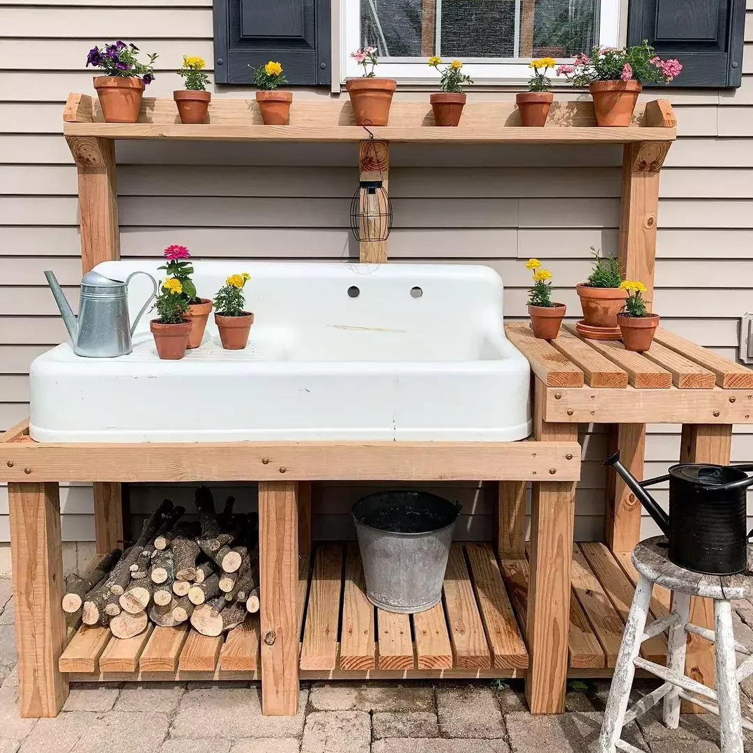 12 Brilliant Outdoor Sink Ideas That Will Transform Your Backyard 3 Try This Outdoor Sink and Potting Bench Combo