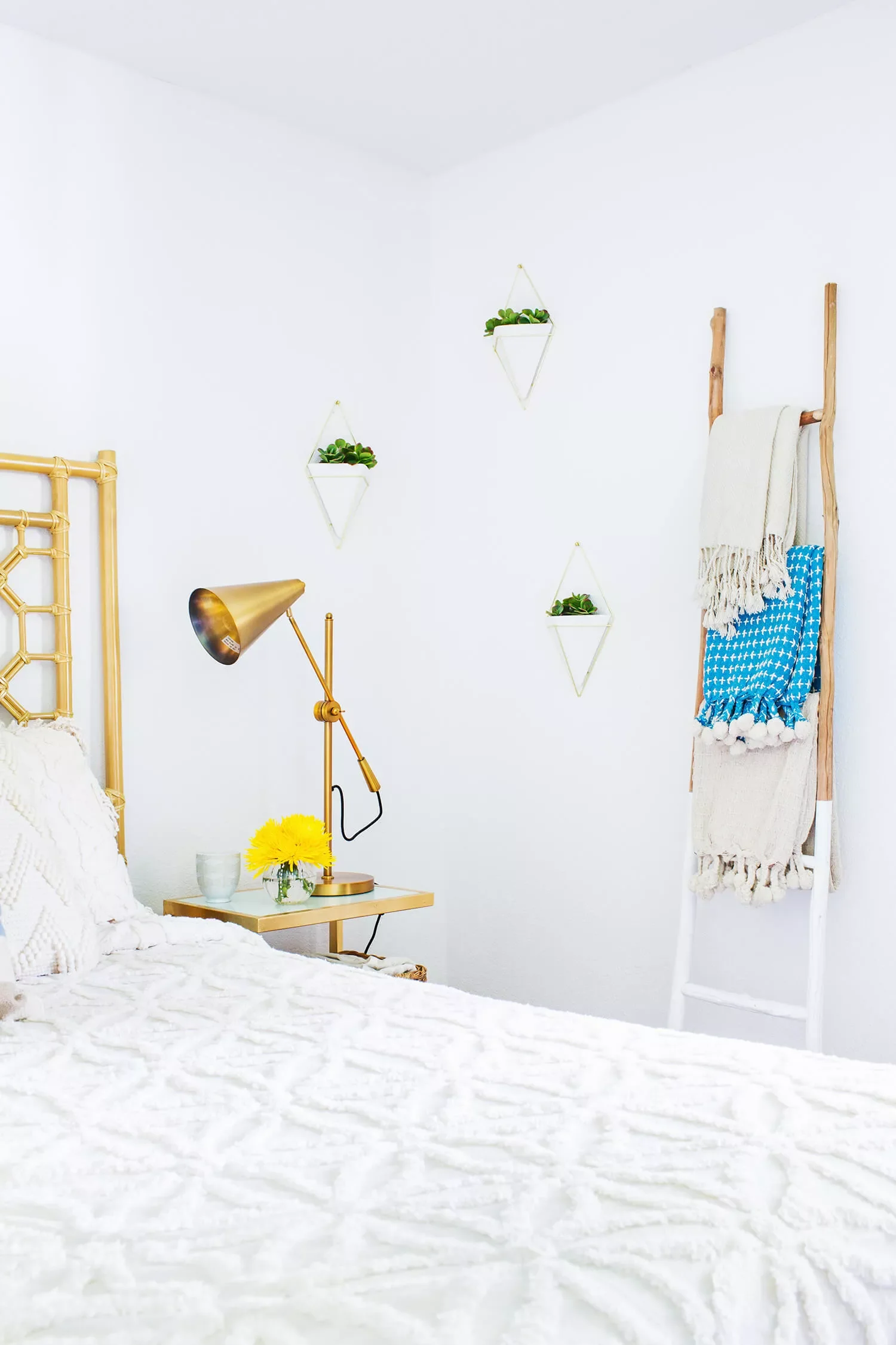 22 Smart Guest Bedroom Ideas That Make Small Spaces Feel Huge 17 Try a Blanket Ladder