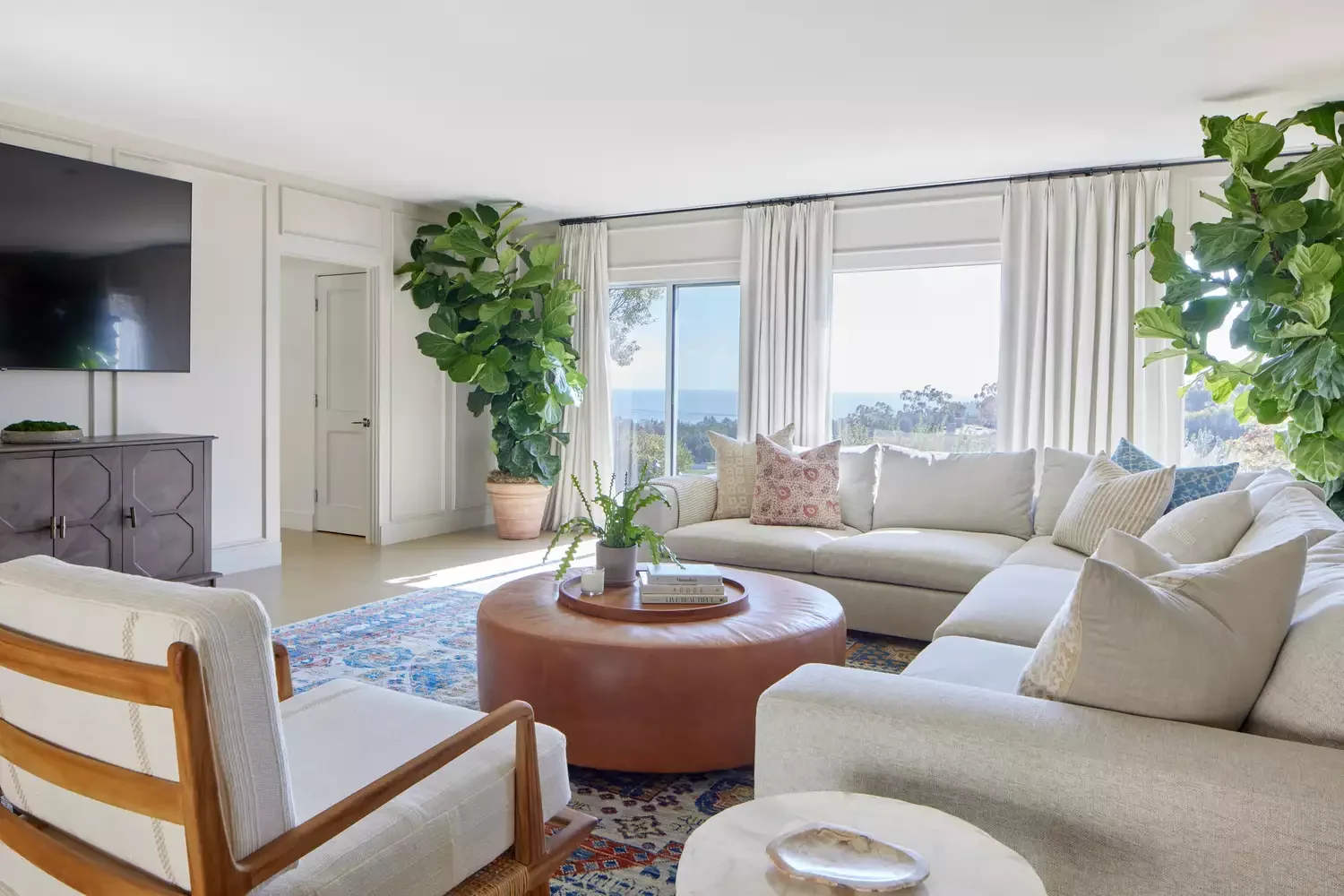 50 Elegant Living Room Ideas That Feel Warm and Inviting 20 Try a Coffee Table Ottoman