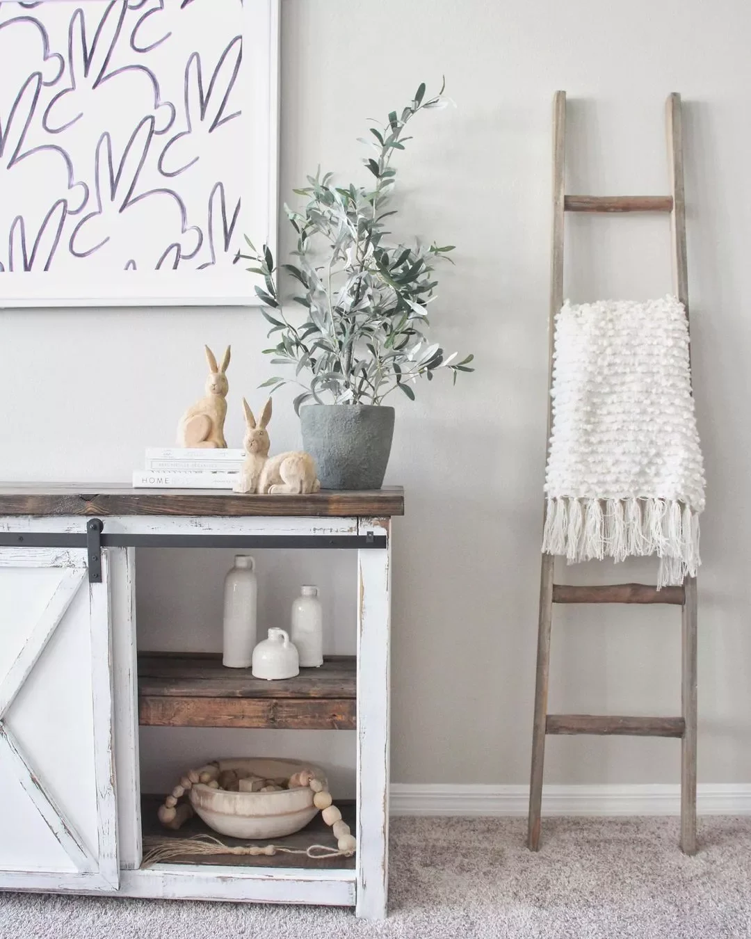 22 Beautiful Ways to Style Your Farmhouse TV Stand That'll Transform Your Space 6 Try a Potted Olive Tree