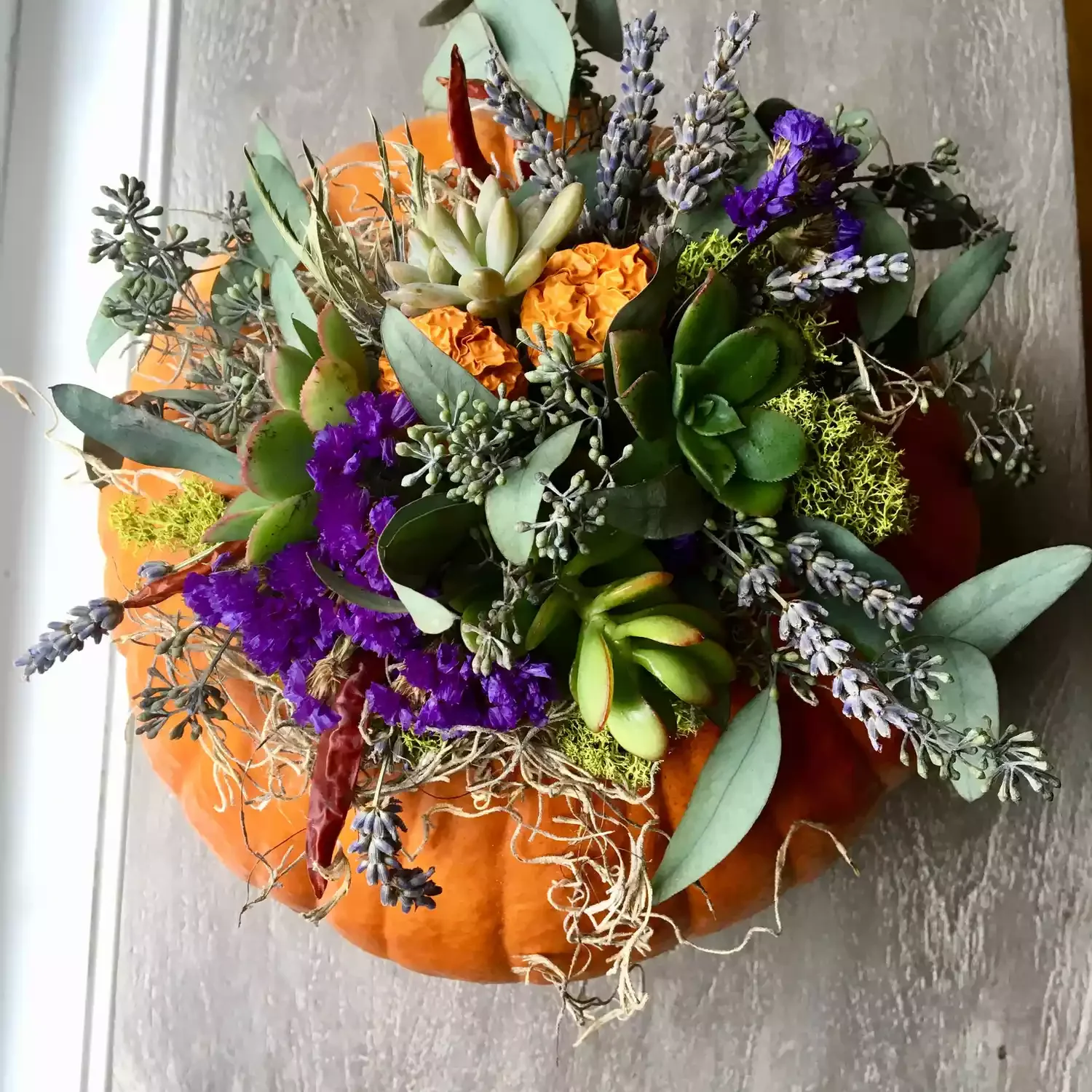 30 Stunning Fall Decor Ideas to Transform Your Outdoor Space Into an Autumn Paradise 29 Try a Pumpkin Succulent Planter