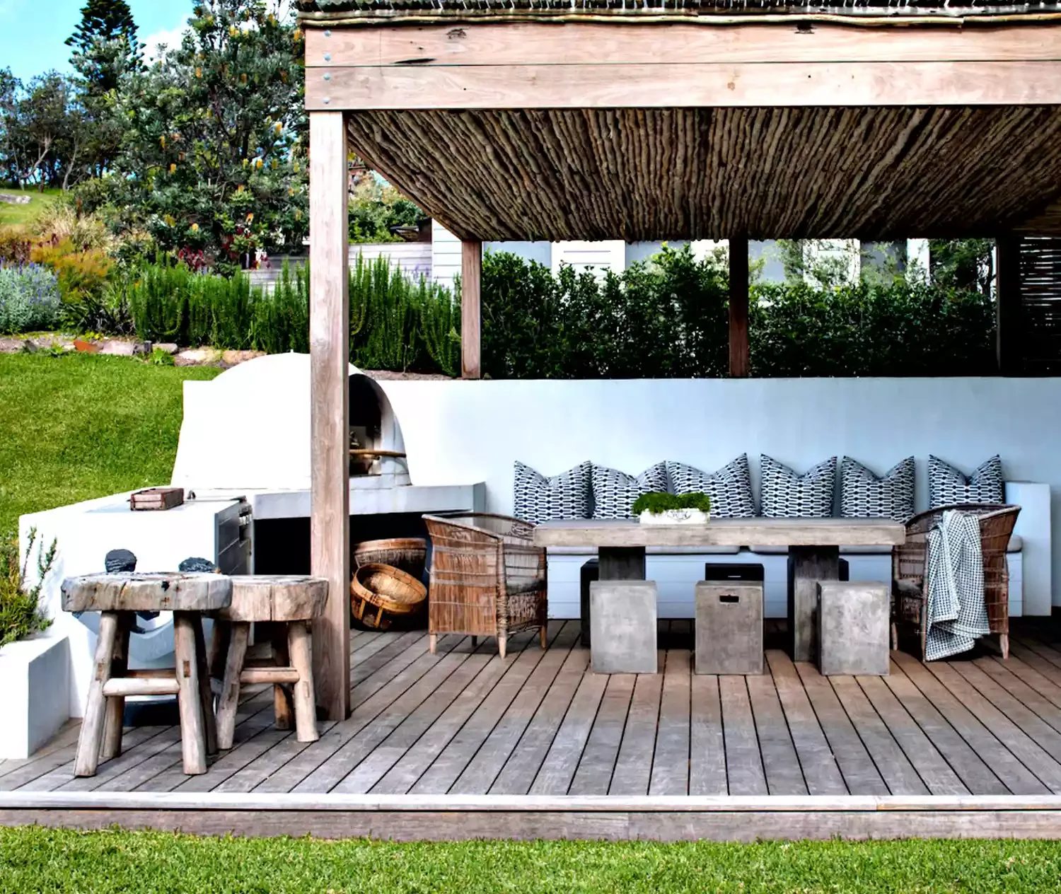 24 Stunning Covered Deck Ideas That Transform Your Outdoor Living Space 3 Try a Thatch-Style Roof