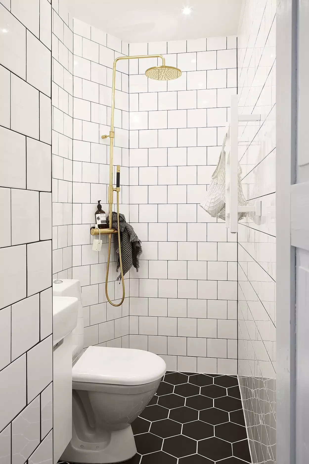 22 Clever Ways to Make Your Narrow Bathroom Feel Spacious and Stylish 3 Try a Wet Room Layout