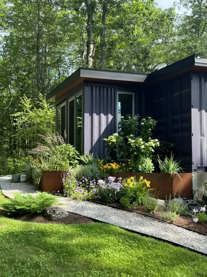 19 Creative Shipping Container Home Designs That Will Inspire Your Next Project 9 Tucked In Lush Foliage