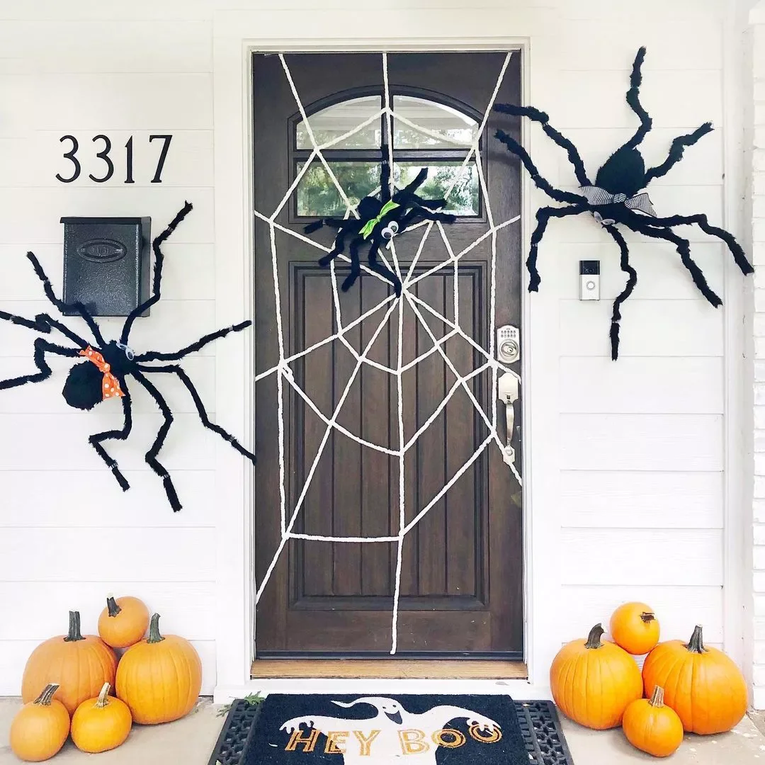 33 Spooktacular Halloween Front Porch Ideas That'll Make Your Home the Neighborhood's Must-See Destination 18 Turn Your Door Into a Spider Web