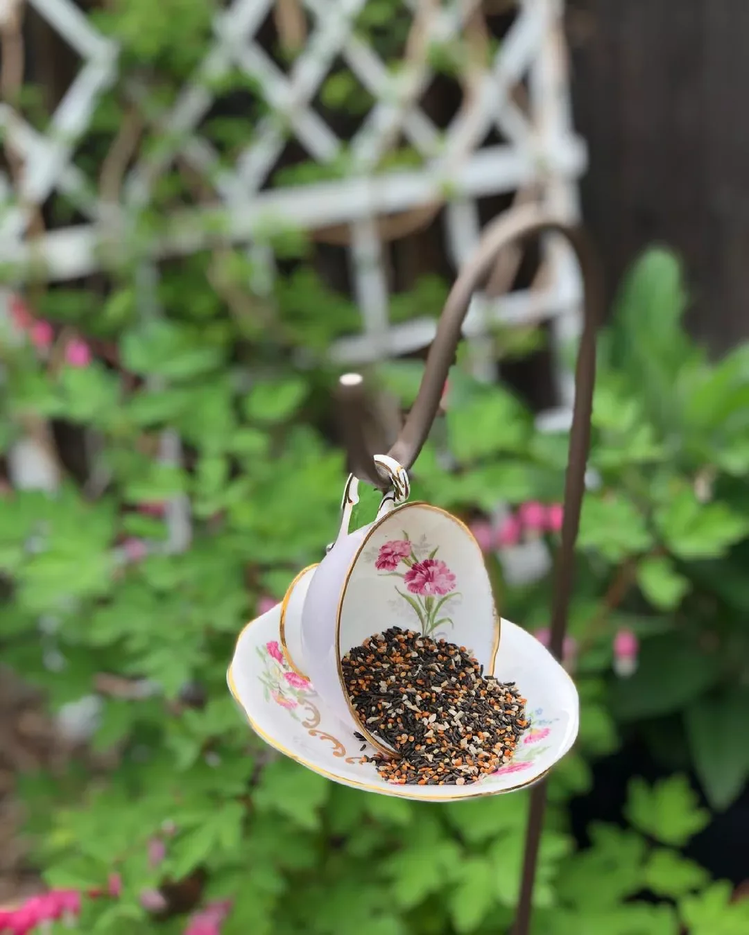 43 Budget-Friendly Backyard Makeover Ideas That Look Expensive 29 Upcycle a Tea Cup into a Bird Feeder