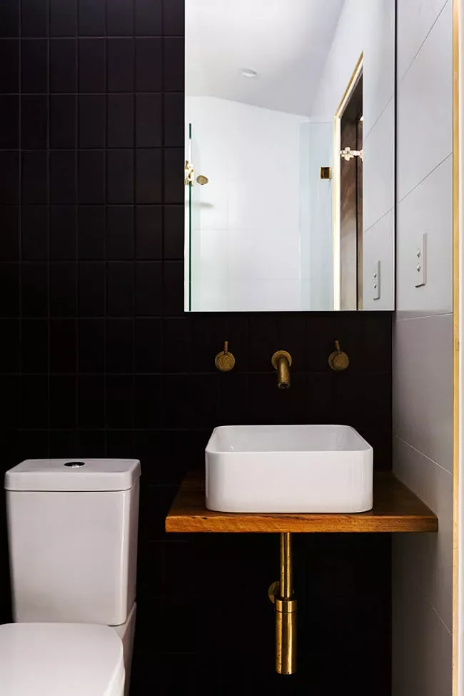 31 Stunning Black Bathroom Ideas That Create the Ultimate Stylish Retreat 28 Use Brass Hardware