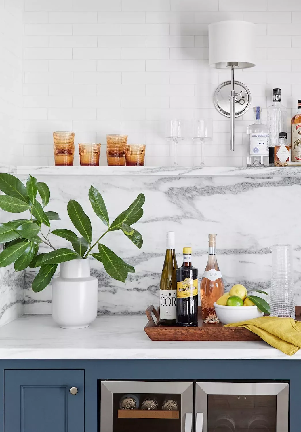 45 Shelf Styling Ideas That'll Transform Your Space Like a Design Pro 29 Use Colored Glassware