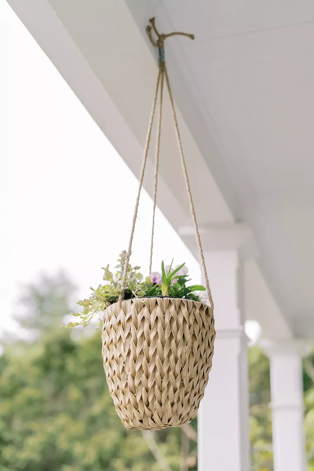 38 Charming Farmhouse Porch Ideas That Create the Perfect Welcome 13 Use Hanging Baskets
