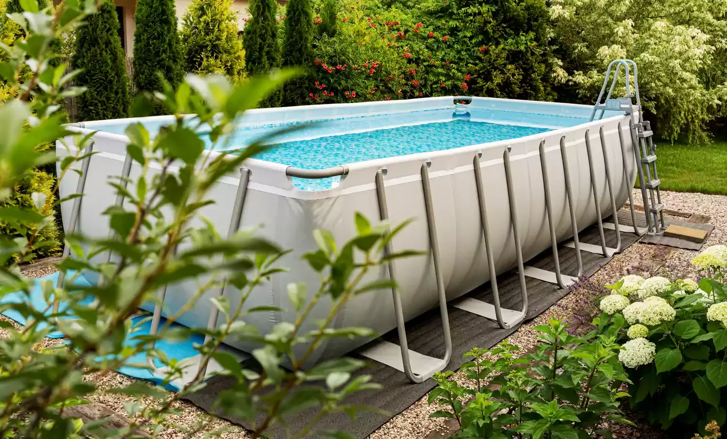 37 Brilliant Above-Ground Pool Deck Ideas That Won't Break Your Budget 33 Use Pea Gravel and Greenery