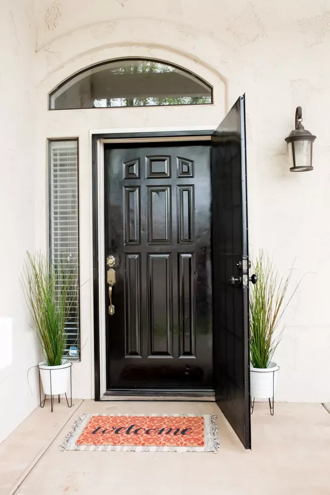 33 Stunning Black Front Door Ideas That Transform Your Home's Entrance Use Plants to Add Color