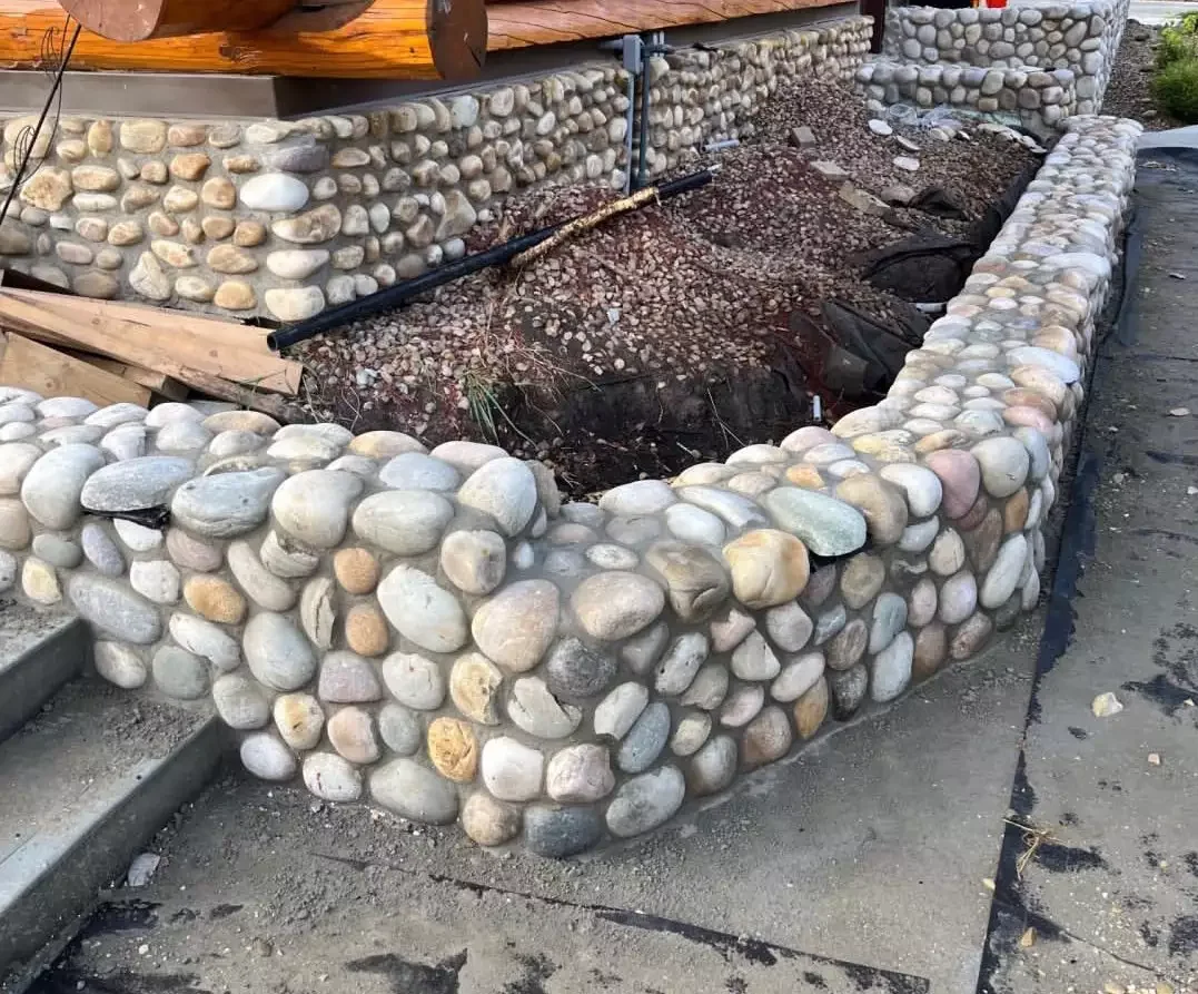 21 Budget-Friendly Retaining Wall Ideas That Transform Your Landscape Use River Rock Veneer