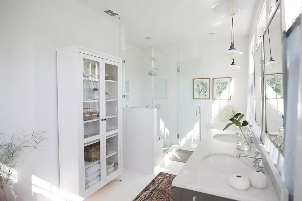 35 Brilliant Bathroom Organization Ideas That Will Transform Your Space Instantly Use a Freestanding Cabinet for Linens