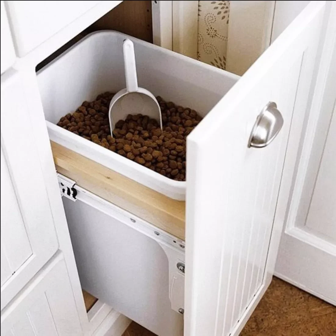 10 Stylish Dog Food Storage Solutions That Blend Into Your Home Decor Use a Pull-Out Trash Drawer