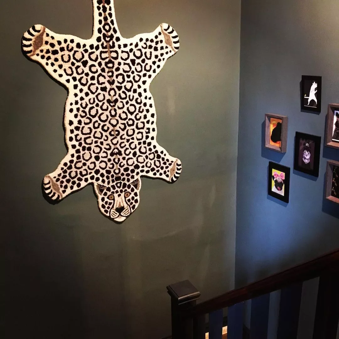 30 Creative Staircase Wall Decorating Ideas That Will Transform Your Space 5 Use a Rug as Decor