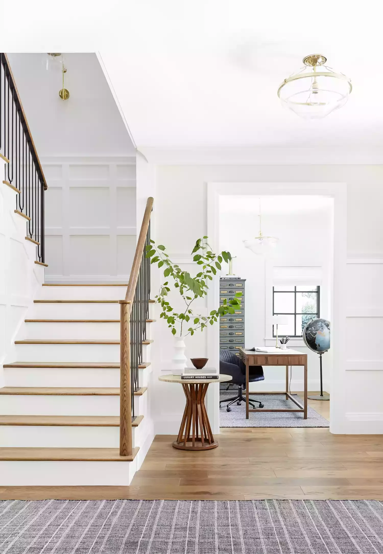 32 Staircase Design Ideas That Transformed Homes This Year Use a Sconce in the Landing