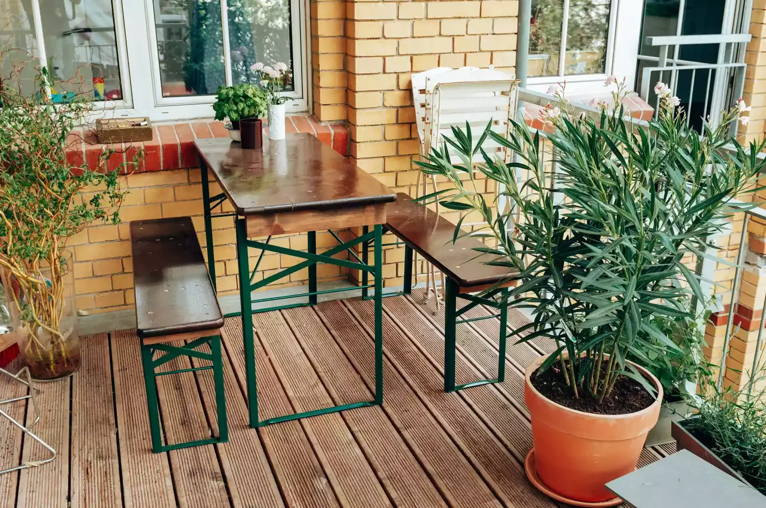 30 Creative Ways to Transform Your Small Deck Into a Stunning Outdoor Retreat 20 Use a Table With Benches
