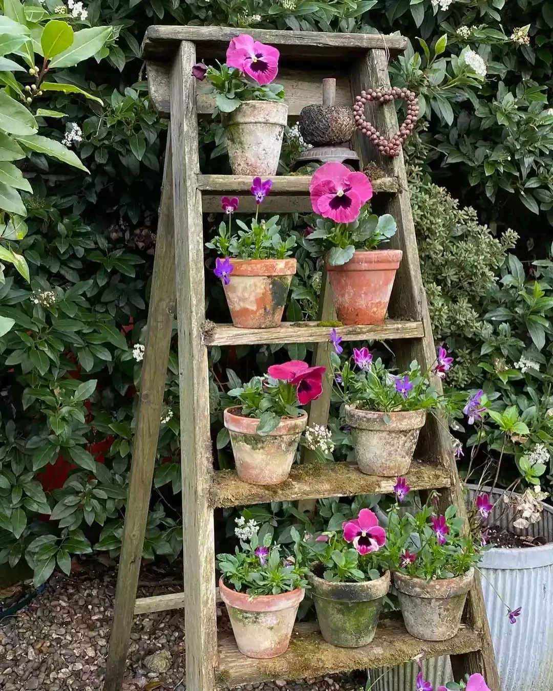 35 Enchanting Cottage Garden Ideas That Transform Your Outdoor Space Into a Magical Retreat Use a Vintage Step Ladder to Display Plants