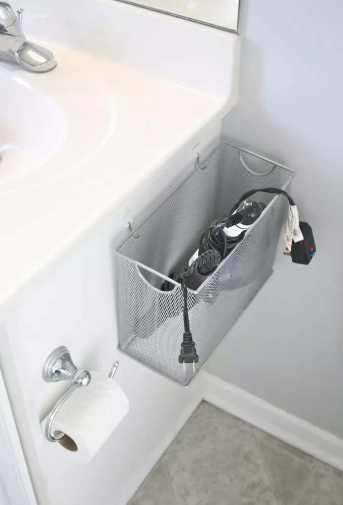 43 Smart Bathroom Storage Solutions That Maximize Every Inch Use a Wire Basket for Hot Tools