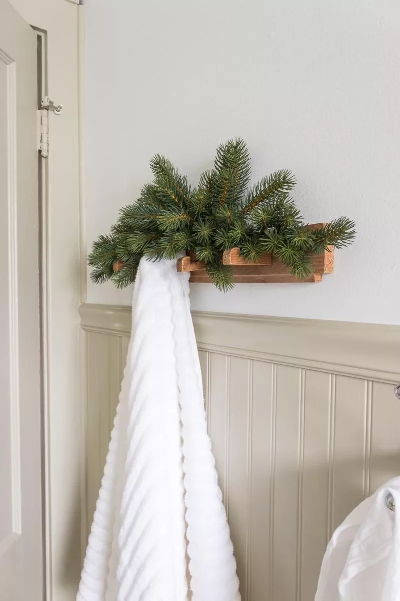 32 Christmas Bathroom Ideas That Create a Holiday Wonderland Use an Easy Faux Pine Swag