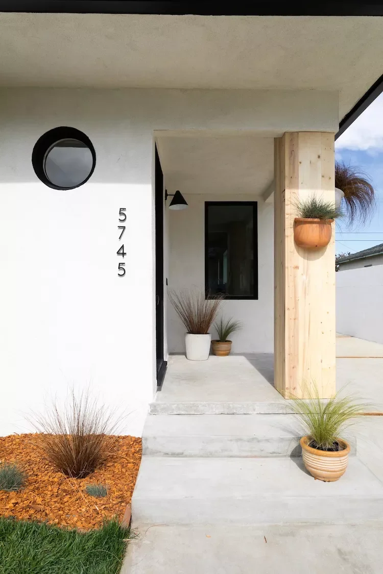 47 Stunning Small Front Porch Ideas That Transform Your Home's Curb Appeal 40 Vary the Height of Planters