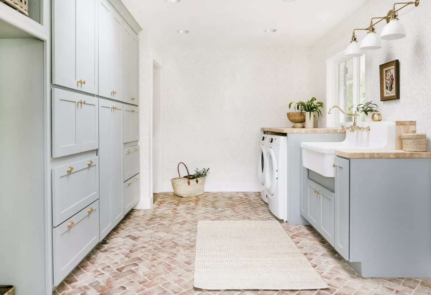 42 Brilliant Laundry Room Organization Solutions to Try This Season Wall of Custom Cabinetry
