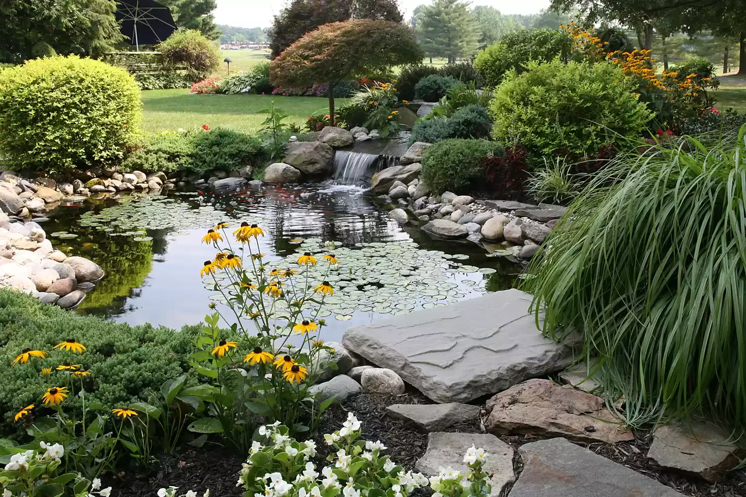 24 Beautiful Koi Pond Designs to Transform Your Outdoor Space Waterfalls in Koi Pond