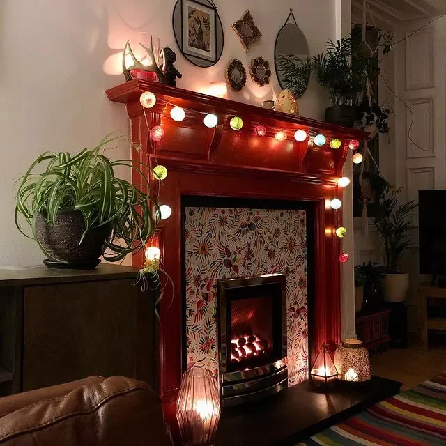 36 Stunning Painted Fireplace Ideas to Transform Your Living Space 27 Weave Lights Around a Painted Fireplace