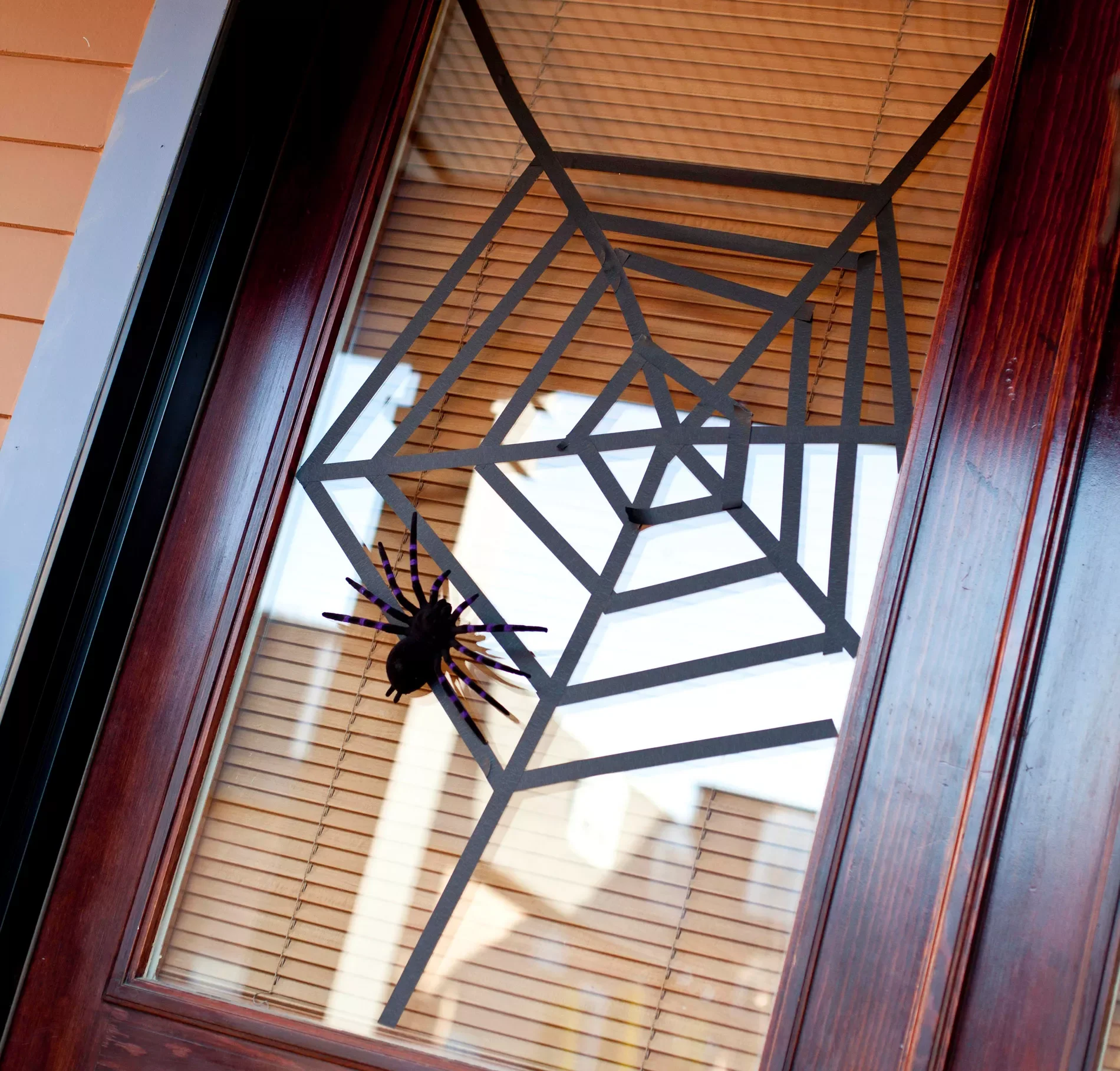 80 Quick Halloween Crafts You Can Complete in One Day 76 Webbed Window Covering