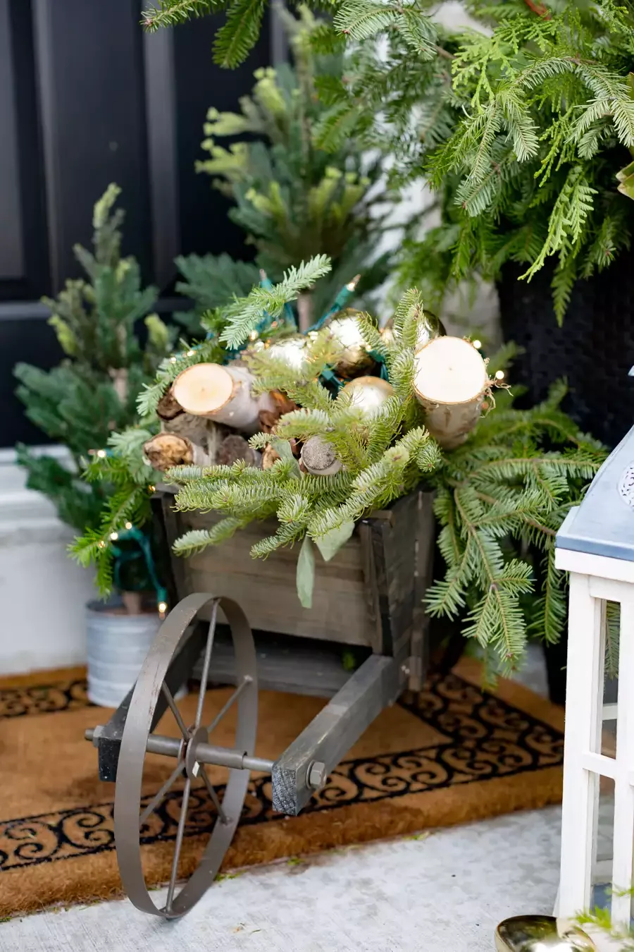 68 Christmas Front Porch Ideas That Make Your Home the Envy Wheelbarrow Vignette
