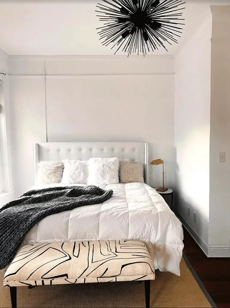 40 White Bedroom Ideas That Will Transform Your Space Into a Stunning Retreat 16 White Bedroom With Patterned Bench