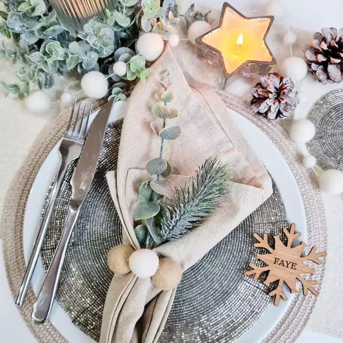 14 Stunning Christmas Napkin Folding Techniques to Transform Your Holiday Table 8 Wintery Christmas Bouquet