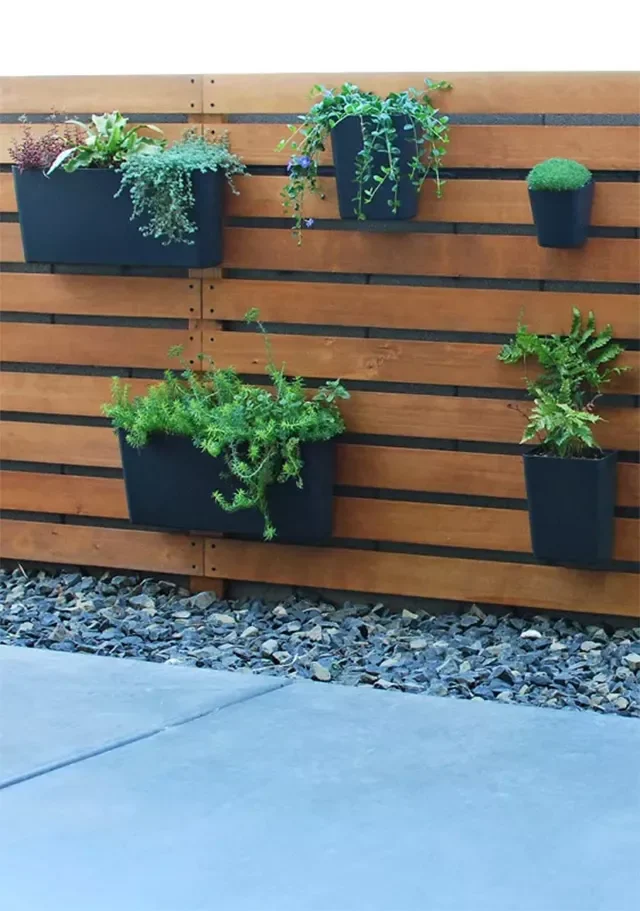 28 Creative DIY Vertical Garden Projects to Transform Your Space Wood Slat Fence with Planters