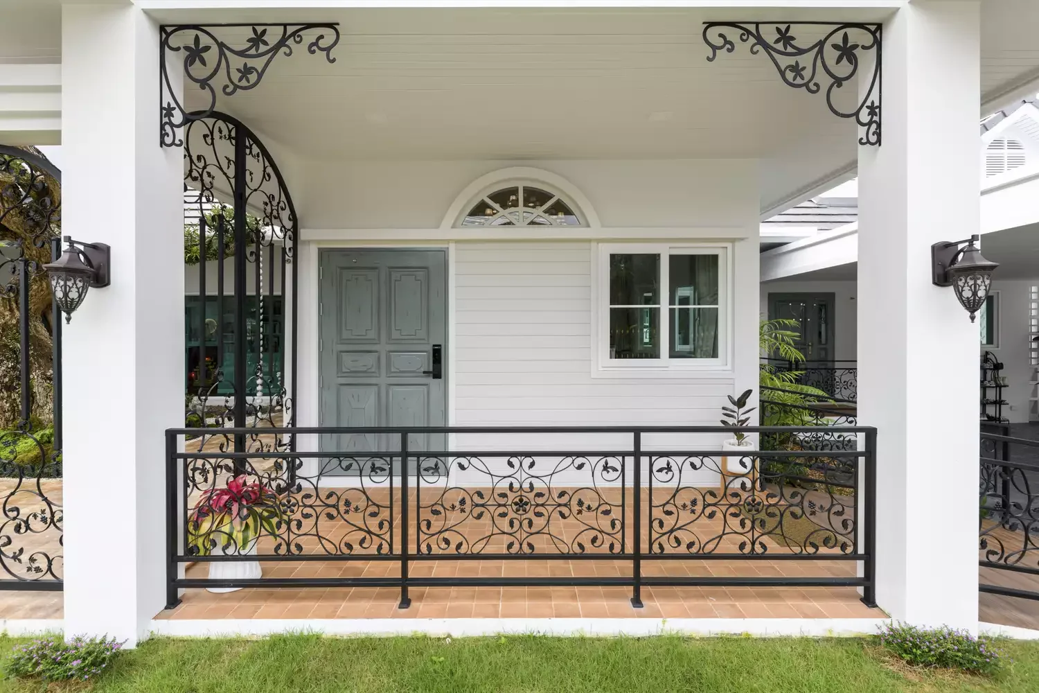 30 Stunning Porch Railing Designs to Transform Your Outdoor Space 29 Wrought Iron Railing